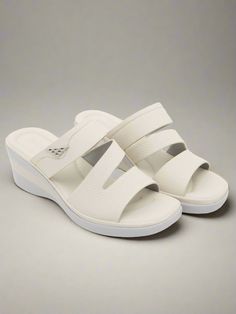 Upgrade your summer wardrobe with Siketu's Rica Cushioned Wedge Slides in Cream. These stylish and comfortable slides provide cushioned support with a trendy wedge design, making them the perfect addition to any outfit. Elevate your fashion and your comfort with these must-have slides. 2.36'' heel Slip-on PU upper Synthetic Arch support footbed™ Cushioned Insole™ Anti-skid rubber sole Trendy Wedges, Wedge Slides, Shoe Makeover, Reindeer Headband, Daily Dress, Dress Jewelry, Accessories Necklace, Arch Support, Summer Wardrobe