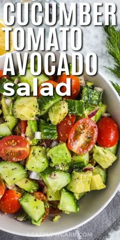 cucumber tomato avocado salad in a white bowl with the title above it