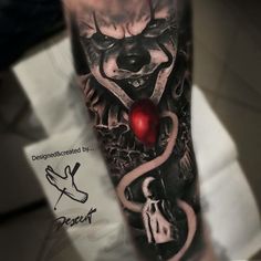 a man's leg with an evil clown tattoo on it and a red ball in his mouth