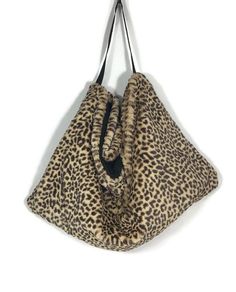 "Leopard Faux Fur Hobo Bag Leopard Print Faux Fur Shoulder Bag Leopard Faux Fur Shoulder Bag Extra Large Leopard Shoulder Bag Fur Hand Bag LINING ALERT....bag in images sold out. New bags will have a black cotton quilted lining FREE DOMESTIC SHIPPING...on additional Purses...think Holiday Gifting *Please click here for my complete selection of hobo bags, handbags and clutch bags https://www.etsy.com/shop/LooptheLoop?section_id=16009221 *Faux Fur Collection click here https://www.etsy.com/shop/Lo Luxury Leather Leopard Print Shoulder Bag, Luxury Leopard Print Shoulder Bag, Leopard Print Satchel Shoulder Bag For On-the-go, Fur Handbag, Leopard Purse, Sequin Hat, Leopard Print Shoulder Bag With Animal Design, Bag Lining, Fur Handbags