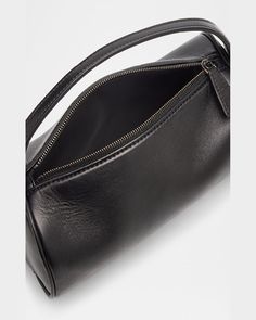 "Find THE ROW Baguette on Editorialist. The THE ROW Baguette is crafted from napa leather and features a top handle, zip top closure, and measures approximately 5.1\"H x 7.9\"W x 3.9\"D. This baguette is made in Italy." Modern Leather Clutch Baguette Bag, Elegant Clutch Baguette Bag With Zipper Closure, Formal Baguette Shoulder Bag With Zipper Closure, Evening Satchel Baguette Bag With Zipper Closure, Evening Baguette Clutch With Zipper Closure, Luxury Evening Baguette Bag With Round Handle, Evening Clutch Baguette Bag With Zipper Closure, Evening Clutch Baguette Bag With Zipper, Formal Leather Baguette Bag With Top Handle