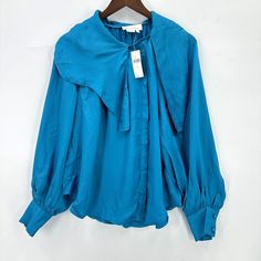 Anthropologie Blouse Womens Long Sleeve Button Down Asymmetrical Blue S Nwt Spring Asymmetrical Tops With Button Closure, Asymmetrical Tops With Button Closure For Spring, Spring Top With Asymmetrical Hem And Button Closure, Summer Asymmetrical Tops With Button Closure, Asymmetrical Summer Tops With Button Closure, Spring Blouse With Asymmetrical Hem And Button Closure, Asymmetrical Tops With Button Closure For Work, Asymmetrical Work Tops With Button Closure, Chic Top With Buttons And Asymmetrical Hem