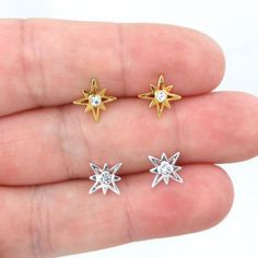 A sweet pair of North Star earrings in Sterling Silver!The earrings are made of 925 silver and the gold earrings are 14K gold plated over sterling silver (gold vermeil). There is a small Cubic Zirconia stone set in the center.They are size 9mm x 9mm.These earrings are great for those with sensitive ears.Mix and match with my other stud earringsIncludes sterling silver earring backs.This listing is for one pair (2 pieces). Starburst Earrings For Pierced Ears As Gift, Gold Star Earrings, Starburst Earrings, Earrings Dainty, Gold Star, Dainty Earrings, Silver Earring, North Star, Earrings Sterling Silver