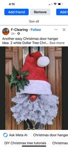 an image of a christmas door hanger with santa hat and holly wreath on it