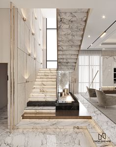 an elegant living room with marble walls and stairs