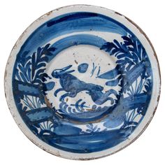 a blue and white plate with an animal on it