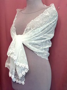 "A chic white wedding cape made of high-quality, slightly elastic fabric. The shrugs shawl is embroidered with silk threads and the hem ends in macramé lace. Bolero, a shawl covering the shoulders of the bride. Scarf measures 58\" x 20\" (150cm x 50cm). Due to the delicate nature of the product, the scarf is a final sale and non-returnable, but if you have any questions, please contact me, I will definitely resolve the issues." Elegant Fitted Lace Shawl, Elegant Embroidered Wedding Shawl, Fitted Elegant Shawl With Lace Trim, Elegant Lace Shawl Scarf, Elegant Fitted Shawl With Lace Trim, Elegant Lace Shawl Dupatta, Fitted Shawl For Mother Of The Bride, Elegant Cream Lace Shawl, Elegant White Lace Dupatta