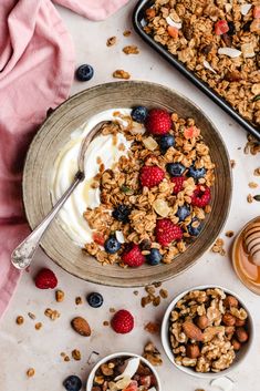 a bowl of granola with yogurt and berries