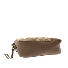 This Gucci Bree crossbody bag is made of light brown GG canvas. The Bag features brown leather trim, gold detailing, an adjustable flat leather shoulder strap, a zippered top opening, and zippered and slip pockets inside. The Bag can be  across the body or loosely over the shoulder. Timeless Handbag, Vuitton Bag, Bags Designer Fashion, Exclusive Bag, Prada Bag, New Bag, Leather Trims, Inside Pocket, Light Brown