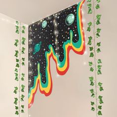 a room decorated with garlands, lights and wall hangings in the shape of planets