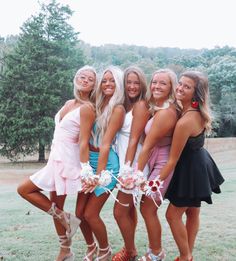 a group of women standing next to each other