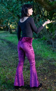 The Slim Bell Pants are the go to every day pant aka "the yoga pants." These puppies should be in constant rotation in your closet. We have taken our Flow Pant and toned it down on the flare and turned it up on the fit from hip to knee. Design Features: Wider waist band hits just under belly button Low rise center seam Hugs hips and legs to knee Slight flare at knee Great for every day, dance, movement, hooping and yoga Made in San Francisco, CA, USA Fabric Features: Rich boysenberry soft crush Stretch Full Length Purple Pants, Stretch Yoga Pants For Fall, Fall High-waisted Yoga Pants, Fall Yoga Wide-leg Leggings, Fitted Purple Hip-length Bottoms, Purple Stretch Wide Leg Bottoms, Fitted Straight Leg Yoga Pants For Fall, Fitted Bottoms For Yoga In Fall, Fitted Yoga Bottoms For Fall