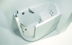 a white bath tub sitting inside of a bathroom