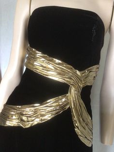 "Vtg 80s A J Bari black and gold Velvet sleeveless Cocktail Dress 8 Preowned. Condition 10/10. No issues to note.  Style A straight form fitting knee length dress,  the bodice is boned for structure and support. Gold lame ribbon swaiths across the bodice give further definition and a unique aspect to this dress. Suitable for any formal, social event, this dress would be a valuable go to in any fashion fashionista wardrobe. Easy to style Fully lined Fastens with a centred rear zip. 7.5\" Front centre kick pleat.  Clipped to the mannequin. Size to fit Australian 10 Go by measurements below garment laid flat Underarm to underarm. 17\". 43cm Waist. 14\". 35.5cm Hips. 18.5\". 47cm Length from underarm. 32\". 81cm Be unique, wear vintage. My photos form an important part of the product descripti Gold Dress Aesthetic, Black And Gold Dress, Casino Dress, Gold Chic, Clawdeen Wolf, Gold And Black Dress, Golden Dress, Velvet Cocktail Dress, Gold Outfit