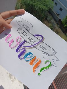 a person holding up a sign with the words hope not now written in rainbow letters