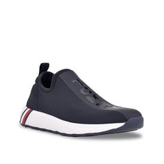 Tommy Hilfiger-Arizel Slip-On Sneaker Get that casual-contemporary look with the Arizel slip-on sneaker from Tommy Hilfiger. An iconic logo wordmark creates an expressive style to the jogger sneaker, further styled with a signature flag print at the midsole. Tommy Hilfiger Sneakers With Cushioned Footbed For Sports, Tommy Hilfiger Synthetic Sneakers For Sports, Sporty Tommy Hilfiger Synthetic Sneakers, Tommy Hilfiger Sporty Synthetic Sneakers, Tommy Hilfiger Slip-on Synthetic Sneakers, Slip On Sneaker, Tommy Hilfiger, Slip On, Navy