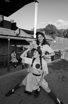 two women dressed in costume posing for a photo