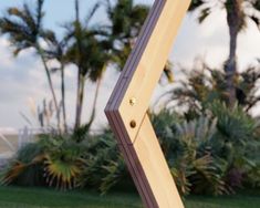 a close up of a wooden object in the grass