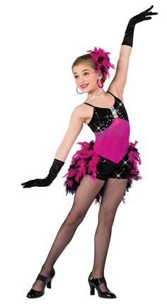 a woman in a pink and black costume is posing with her arms out to the side