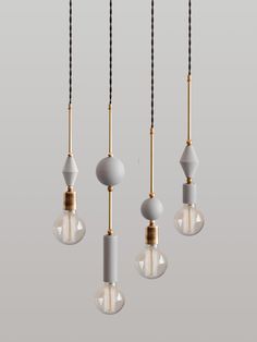 three light bulbs hanging from the ceiling