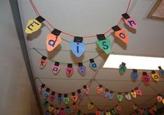 there are many colorful letters hanging on the wall