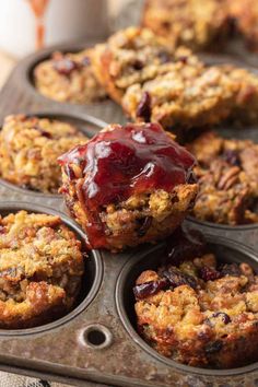 muffins with fruit and oatmeal toppings in a muffin tin