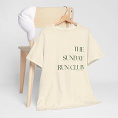 Join "The Sunday Run Club" in style with this vintage-inspired unisex t-shirt. Designed for runners, joggers, and anyone who loves to keep it casual, this retro-themed tee is both a stylish and eco-conscious choice. Whether you're running on the weekends or simply enjoying a relaxed day, this shirt brings comfort and a timeless look to your wardrobe. The minimalist typography gives a cool, classic aesthetic, ideal for those who appreciate both performance and fashion.  Perfect for anyone who enjoys running, from slow-paced runners to seasoned marathoners. 100% ethically grown US cotton  Unisex fit: Designed to suit all body types and shapes. Colors: White, Ice Grey, Black, and Natural Fabric: Durable, high-quality fabric, soft and breathable  💯 Happiness is guaranteed with our 30-day refu Cool T-shirt, Running Club Tshirt Design, Run Club Shirt, Marathon Shirt Design, Crew Neck T-shirt For Running, Casual Running T-shirt With Logo Print, White Graphic Print T-shirt For Running, Running T Shirt, Running Funny