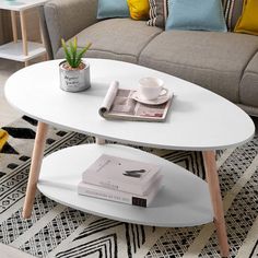 a coffee table sitting on top of a rug next to a couch