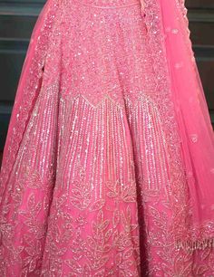 Dreamy pink lehenga with a flowing jaal, mixing floral and geometric embroidery. The outfit has a dramatic trail,embroidered strappy blouse and matching embellished dupatta with sequin crystal and cutdana embroidery.From Isa by Dolly Wahal's Fiori collection.DELIVERY TIMEPlease allow 8-12 weeks for your outfit to arrive.FABRIC DETAILSNetProfessional cleaning only. Strappy Blouse, Lehenga Pink, Cutdana Embroidery, Pink Lehenga, Geometric Embroidery, 12 Weeks, Skirt Length, Lehenga, Sequin