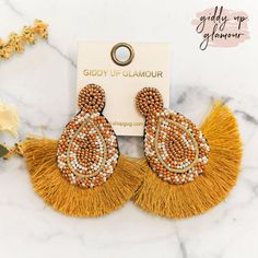 These beautiful seed bead earrings have a post back and lots of colors to make your outfit pop! The fringe trim adds a flirty touch. Earrings measure 2.75 inches long. SKU: #0926-1966 Cheap Adjustable Yellow Beaded Earrings, Summer Party Beaded Fringe Earrings, Gold Beaded Fringe Earrings For Summer, Trendy Beaded Tassel Earrings For Party, Make Your Outfit, Giddy Up Glamour, The Fringe, Early Spring Outfits, Current Fashion Trends