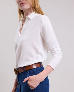 Women's long-sleeved polo tee shirt. Shirt collar and half button placket. Workwear Polo Shirt With Button Cuffs, Work Polo Shirt With Button Cuffs, Classic White Polo Sweater For Work, Timeless Button-up Tops With Placket, Timeless Long Sleeve Shirt With Placket, Timeless Long Sleeve Fall Tops, Classic White Polo Sweater, Timeless Collared Tops For Business Casual, Timeless Tops With Fold Down Collar And Placket