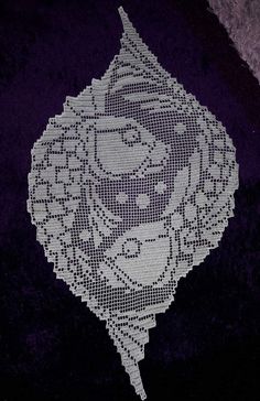 a white doily with an image of a woman's face in the center