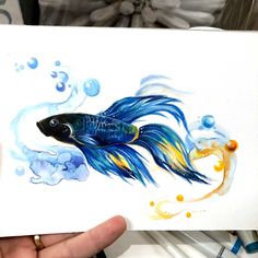 a drawing of a blue and yellow fish