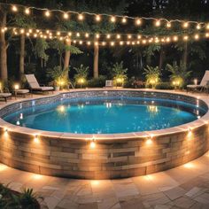 a swimming pool with lights around it