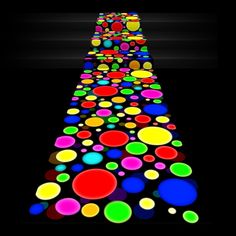 colorful circles are arranged in the shape of a long line on a black background photo