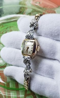 This is a rare, absolutely spectacular, Art Deco white and yellow gold filled 1930's, with 8 diamonds, Bulova women's mechanical watch. What a gorgeous piece of jewelry! There is a white gold and diamonds extended bezel set in yellow gold! Absolutely beautiful! This wonderful dainty watch is in amazing condition,  showing how much it was cherished and loved.  It works well. Please see photos as they speak wonderfully to the beauty and condition of this special bracelet! What a rare, spectacular, Gold Art Deco Wedding Watch, Art Deco Gold Jewelry And Watches For Anniversary, Gold Art Deco Diamond Watch For Anniversary, Vintage Formal Watches With Single Cut Diamonds, Gold Art Deco Watch For Anniversary, Gold Art Deco Anniversary Watch, Vintage White Gold Watches With Jubilee Bracelet, Collectible Gold Art Deco Jewelry And Watches, Art Deco Watches Ladies