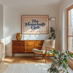 a living room with a large poster on the wall