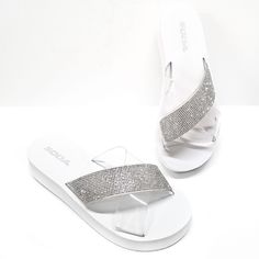 These Light Weight Sandals Are Easy To Wear For Warmer Days New In Box Foam Material Rhinestone Encrusted And Clear Pvc Straps Slip On Style Cushiony Foam Sole Fitting: True To Size Heel Height: 1.5 In. White Synthetic Sandals With Rhinestones, White Rhinestone Sandals For Vacation, Bed Stu Sandals, Leather Birkenstocks, Lace Up Sandal Heels, Foam Sandals, Slip On Wedge Sandals, Toe Loop Sandals, Grey Sandals