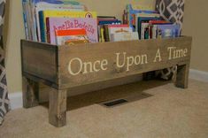 a wooden bench with books on it and the words once upon a time written in white