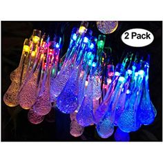 several different colored lights are in the shape of vases with strings attached to them