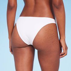 Add a versatile swim separate to your beach-ready closet with this High Leg Extra-Cheeky Bikini Bottom from Shade & Shore™. Made from soft fabric with spandex and full lining for stretchy comfort in and out of the water, this solid-color bikini bottom is designed with a low rise and high leg. The extra-cheeky cut lends you a flattering fit, while the opaque construction offers plenty of coverage for confident wear. Shade & Shore™: Found exclusively at Target. Seamless Nylon Swimwear For Sunbathing, Beachy Stretch Swimwear For Pool, Seamless Summer Bottoms For Beach, White Brief Swim Trunks For Beach, Beach Party Stretch Swimwear, Beachy Stretch Swimwear For Sunbathing, Beachy Stretch Swimwear For Vacation, Seamless Beachy Bottoms For Beach Season, Stretch Bottoms For Sunbathing On Vacation