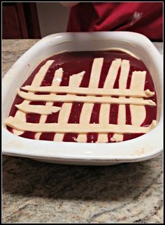 a white dish filled with food on top of a counter