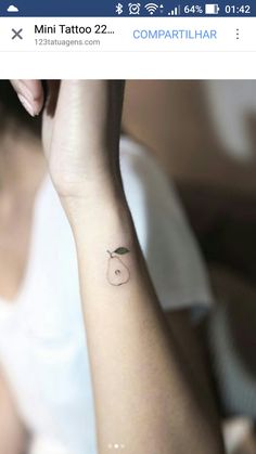 a small apple tattoo on the wrist is shown in this screenshote photo taken by an instagram user