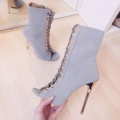 Elevate your style with these Grey Peep Toe Summer Sandal Booties. Featuring lace-up detailing, stiletto heels, and a trendy peep-toe design, these ankle boots are perfect for summer chic looks. Color: Grey Material: Vegan suede Heel Type: Stiletto heel Heel Height: 4.72" / 120 mm approx Product measurements were taken using size 8. Please note that measurements may vary by size. Toe: Peep toe Lace-up design Side zipper closure Handcrafted US sizing. Fits true to size. Gray Summer Party Heels, Chic Fitted Gray Heels, Gray Heels For Spring Party, Gray Party Heels For Spring, Gray High Heel Boots For Party, Lace-up Party Boots With Front Fastening, Gray High Heel Party Boots, Gray High Heels For Spring, Chic Gray Heels For Spring