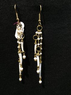 "Pearl Droplet Earrings Artist: Teresa Bradford-Cole Length with gold-filled ear wire: 4\" Pearls, Scaphopoda Shell, with gold-filled spacers and wire. Gorgeous earrings, light to wear, and have so much movement! Yes ~ along with basic simplicity ~ It's all about you You deserve to know about my fabulous Treasure chest HeartbeatHandmade and Big Sur Jade Treasures both (Etsy sites) Tribal Jewelry, Statement Piece Jewelry, Art to Wear Jewelry, Fantastic Fine Leather Beaded Handbags, an array of tr Gold Beaded Dangle Earrings With French Hook, White Wire Wrapped Dangle Hoop Earrings, White Metal Dangle Linear Earrings, White Brass Wire Wrapped Earrings, White Metal Beaded Earrings With Ear Wire, White Metal Drop Earrings, White Metal Beaded Earrings, Gold Dangling Bead Jewelry, Gold Dangling Bead Earrings