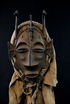 an old mask with horns on it's head