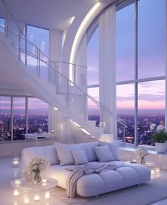 a living room filled with white furniture next to tall windows and candles on the floor