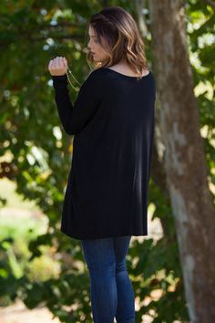 One of the softest tops we've ever felt and a fit that looks great on anyone. You are sure to love these Piko tops. The extra length on this one makes it great to pair with your favorite leggings. The Perfect Piko Tunic is the original piko style that everyone loves. The bamboo blend is soft and easy to care for. The sleeves are fitted and the body is over-sized. The piko tunic is the same style as our "The perfect piko top" But has a few extra inches to add some length. For the shorter girls, t Plain Tops For Layering In Fall, Oversized Black Soft Knit Top, Black Crew Neck Versatile Top, Versatile Black Loungewear Tops, Black Soft Knit Tops, Black Tops For Fall Loungewear, Black Tops For Loungewear In Fall, Casual Black Long Sleeve Top For Fall, Black Long Sleeve Top For Loungewear In Fall