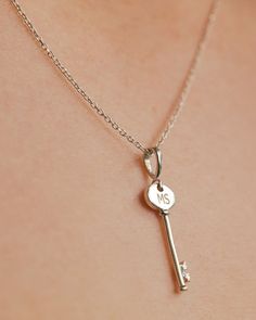 This key necklace is a beautiful, trendy statement piece that can be engraved. It is the perfect necklace to be worn on its own or layered with some of your favorite pieces. NECKLACE DETAILS: Pendant Dimensions: 28.25 x 8.6 mm Chain Length: 16-18 Inches Clasp Type: Lobster Clasp Chain Style: Cable Finish State: Polished Available in: Silver, 14K rose gold, 14K white gold, or 14K yellow gold ****These necklaces have a 4-week lead time. If you need your necklace sooner than that, please contact us Elegant Sterling Silver Key Necklace, Classic Jewelry With Keys For Gifts, Staghead Designs, Key Necklace, Unisex Ring, Engraved Necklace, Design Silver, Gold Wedding Band, Custom Necklace