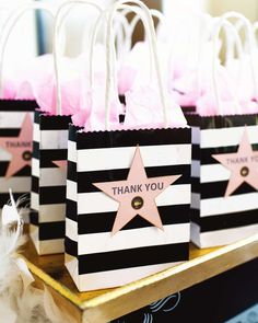 black and white striped bags with pink stars on them